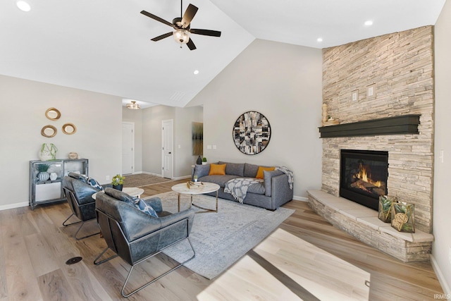 11903 Cross Winds Way, Fort Wayne, IN 46818 - living area featuring ceiling fan, high vaulted ceiling, a fireplace, wood finished floors, and recessed lighting