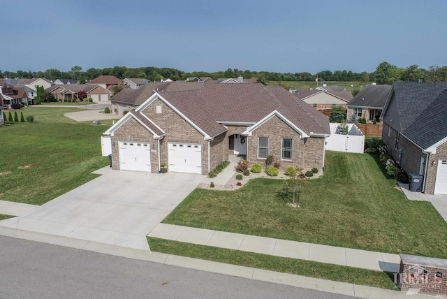 view of front of home with a front lawn and a garage