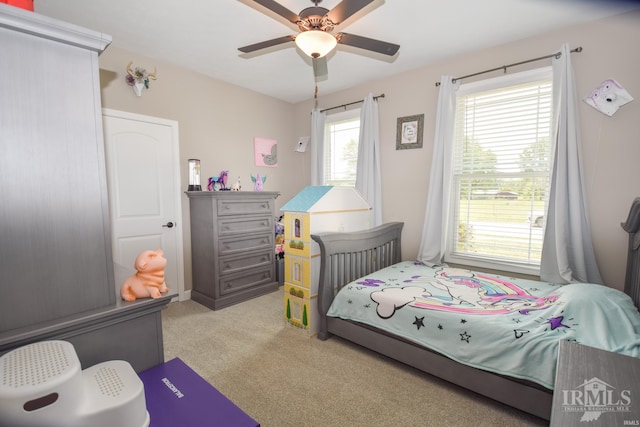 carpeted bedroom with ceiling fan