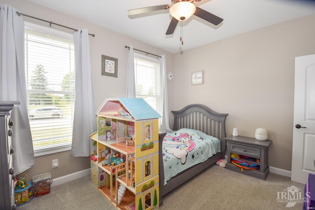 bedroom with light colored carpet and ceiling fan