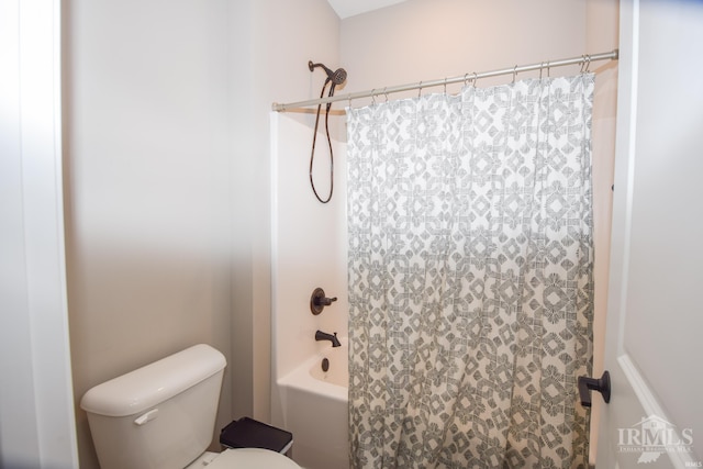 bathroom with toilet and shower / tub combo