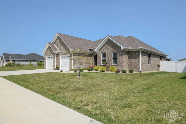 view of front facade with a garage and a front lawn