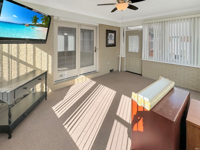 sunroom / solarium with ceiling fan