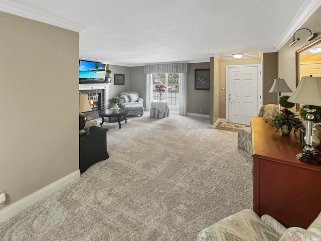 carpeted living room featuring a tiled fireplace, a textured ceiling, and crown molding