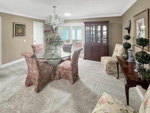 carpeted dining space featuring an inviting chandelier and ornamental molding