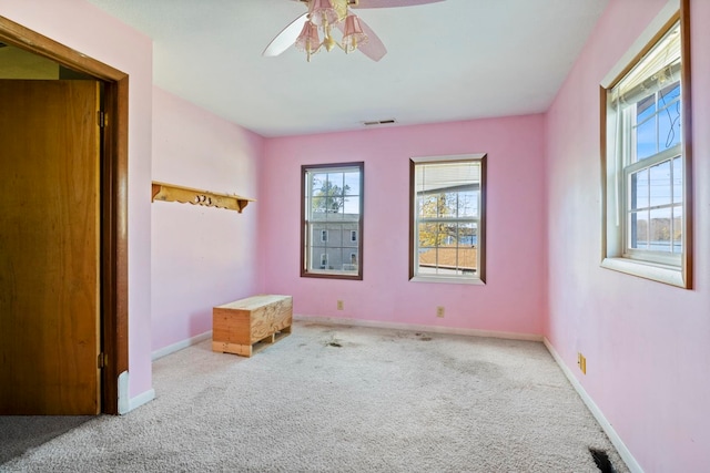 unfurnished bedroom with ceiling fan and carpet floors