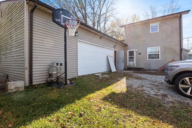 view of side of home with a garage