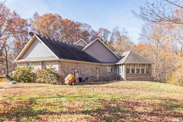 view of property exterior featuring a lawn