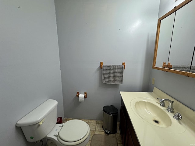 606 S 150 W, Washington, IN 47501 - half bathroom featuring toilet, vanity, and stone finish floors
