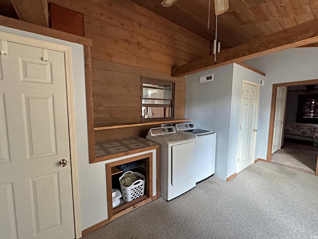606 S 150 W, Washington, IN 47501 - washroom featuring washer and clothes dryer, wood ceiling, wood walls, carpet flooring, and cabinet space