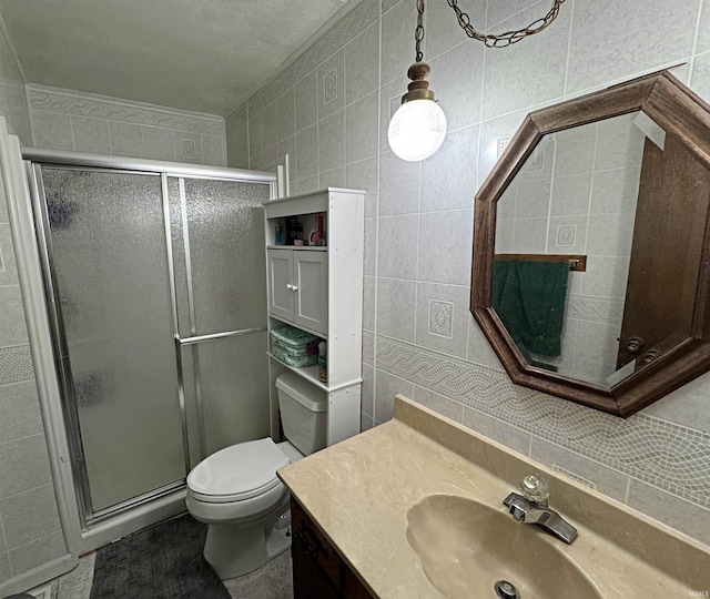 606 S 150 W, Washington, IN 47501 - bathroom with vanity, a stall shower, toilet, tile walls, and backsplash