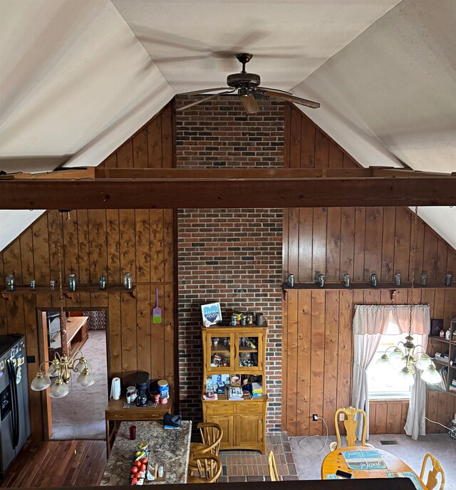 606 S 150 W, Washington, IN 47501 - living area with wood walls, lofted ceiling, ceiling fan, and dark wood-style flooring
