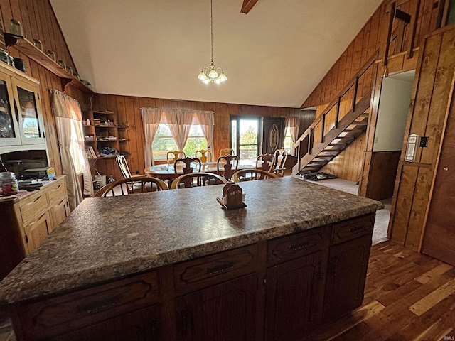606 S 150 W, Washington, IN 47501 - kitchen with wooden walls, dark countertops, dark wood-style floors, a chandelier, and high vaulted ceiling