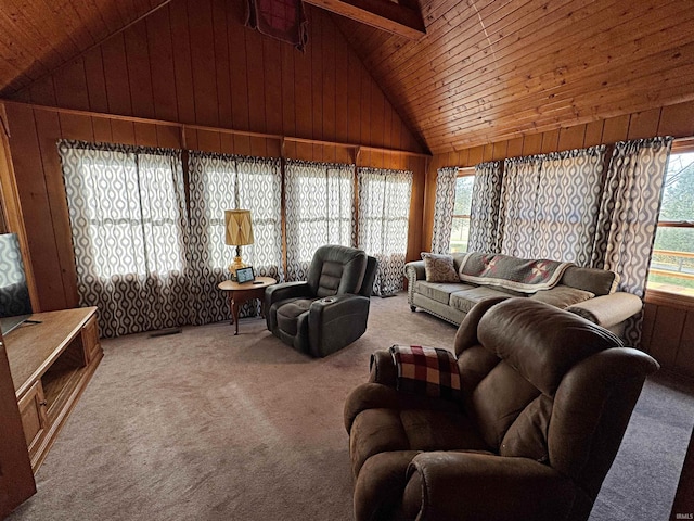 carpeted living room featuring wood walls, wooden ceiling, plenty of natural light, and high vaulted ceiling