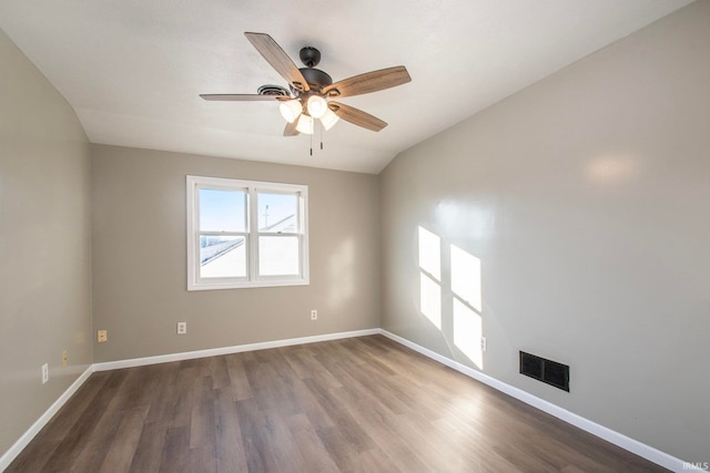 unfurnished room featuring lofted ceiling, hardwood / wood-style floors, and ceiling fan