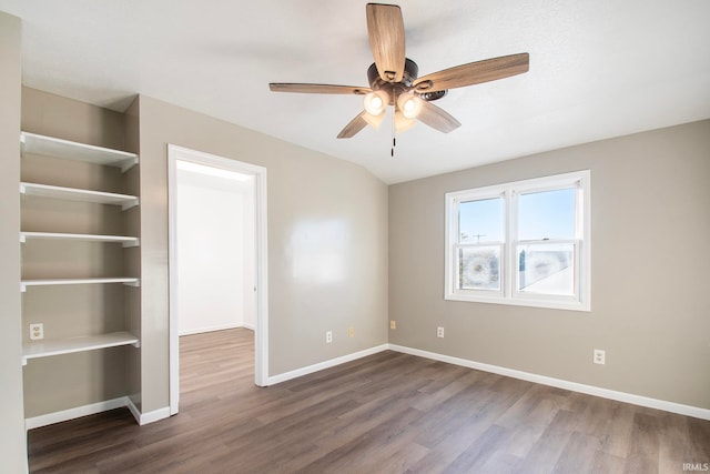 unfurnished bedroom featuring dark wood-type flooring and ceiling fan