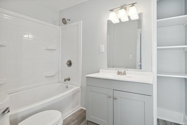 full bathroom with wood-type flooring, vanity, toilet, and bathing tub / shower combination