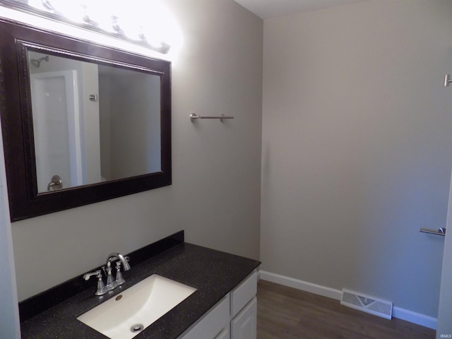 bathroom with wood-type flooring and vanity