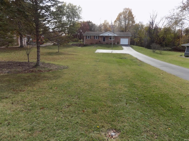 view of front of home featuring a garage and a front lawn