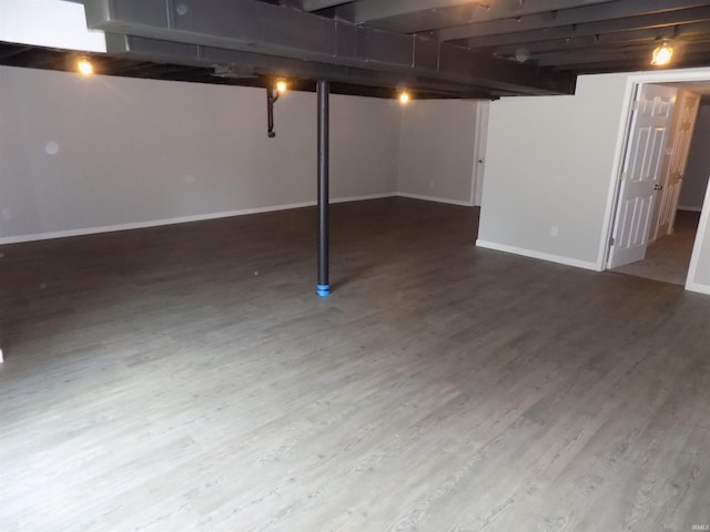 basement featuring hardwood / wood-style floors