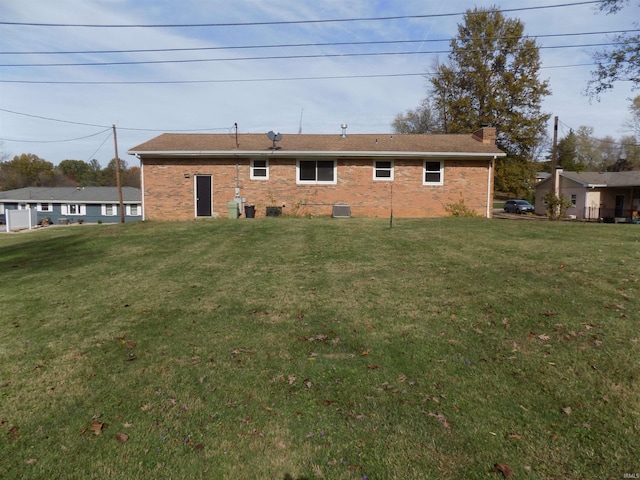 back of house with a yard