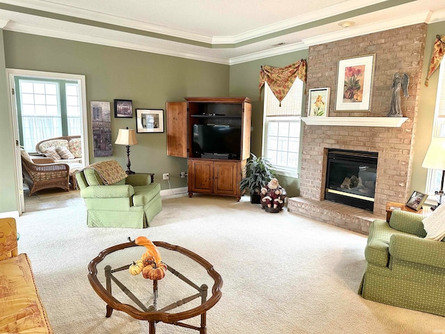 carpeted living room with a fireplace and crown molding