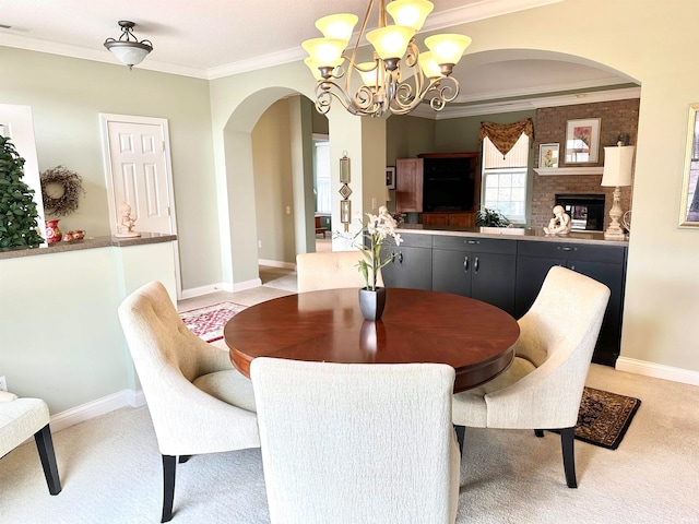 carpeted dining area with crown molding and an inviting chandelier