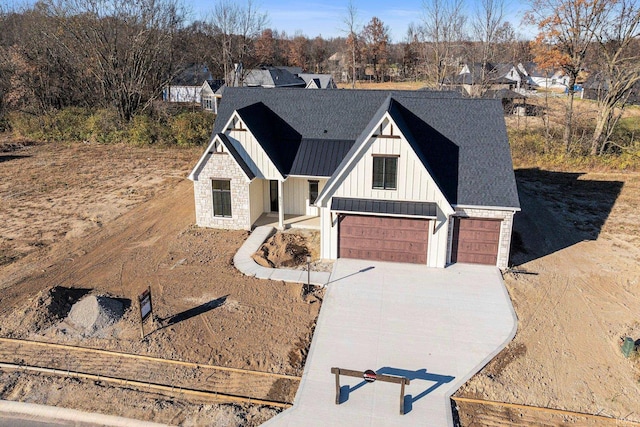 modern farmhouse featuring a garage