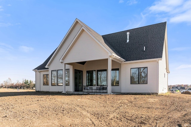 rear view of property featuring a patio area