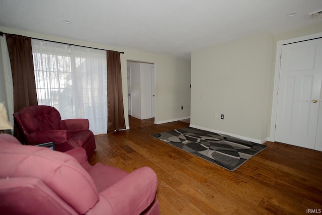 living room featuring dark hardwood / wood-style floors