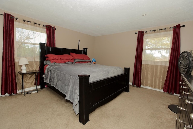 carpeted bedroom with a textured ceiling