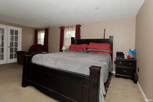 carpeted bedroom with french doors