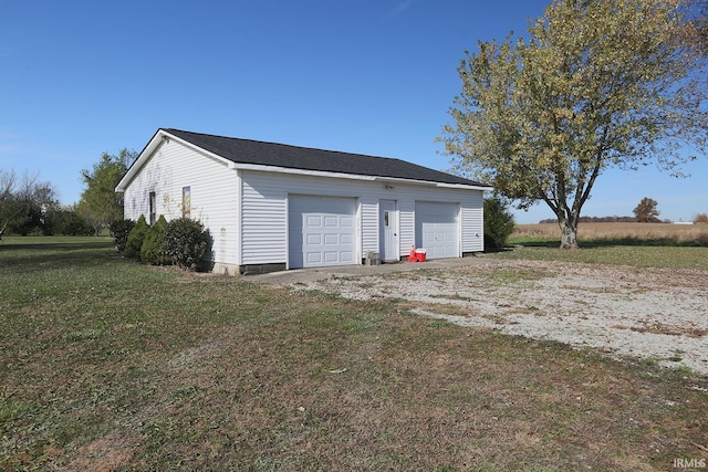 garage with a yard