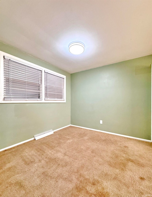 unfurnished room featuring carpet floors