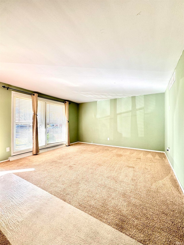 unfurnished room with carpet