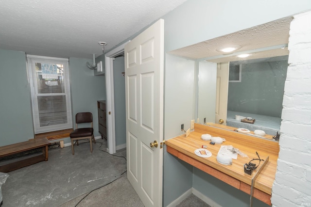 bathroom featuring a textured ceiling