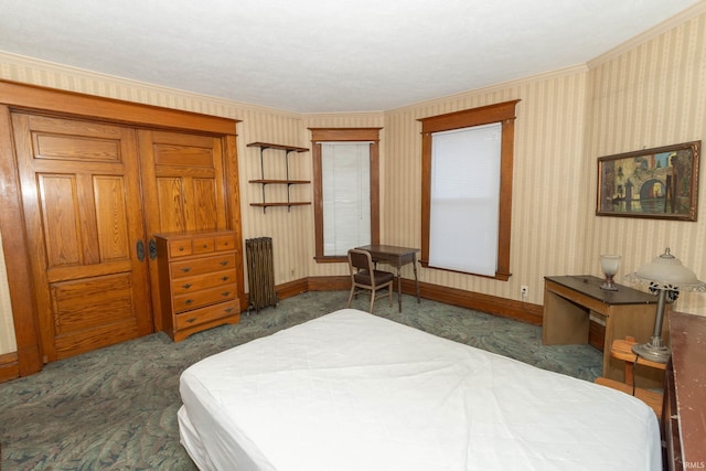 carpeted bedroom featuring radiator heating unit and crown molding