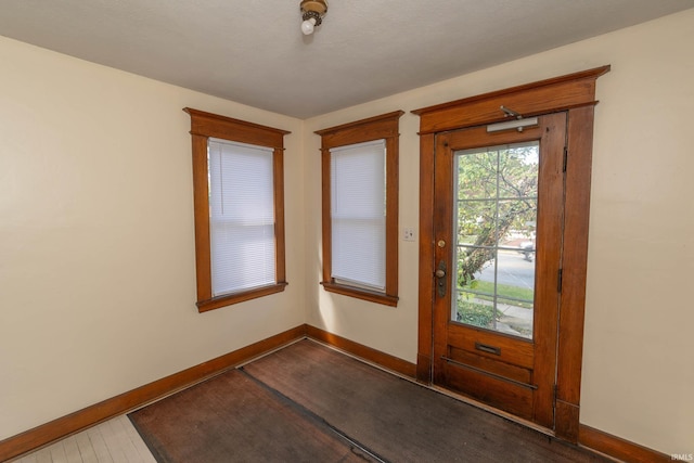 entryway with a textured ceiling