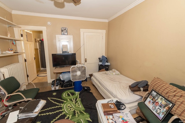 bedroom with radiator, ceiling fan, and ornamental molding