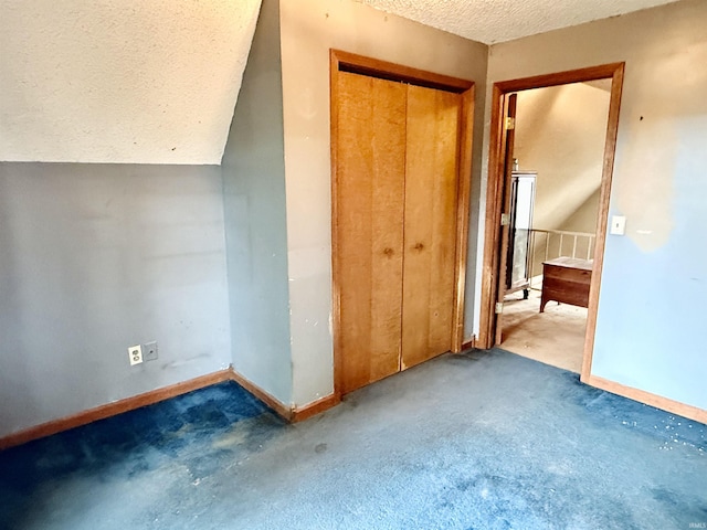 1839 S Meridian Rd, Mitchell, IN 47446 - unfurnished bedroom featuring a textured ceiling, carpet floors, a closet, and baseboards