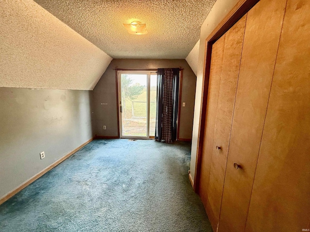 1839 S Meridian Rd, Mitchell, IN 47446 - additional living space featuring a textured ceiling, vaulted ceiling, carpet flooring, and baseboards