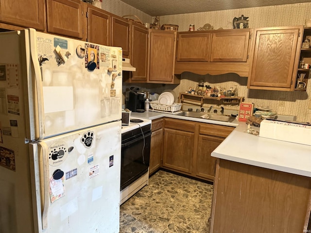 1839 S Meridian Rd, Mitchell, IN 47446 - kitchen featuring white appliances, a sink, under cabinet range hood, light countertops, and wallpapered walls
