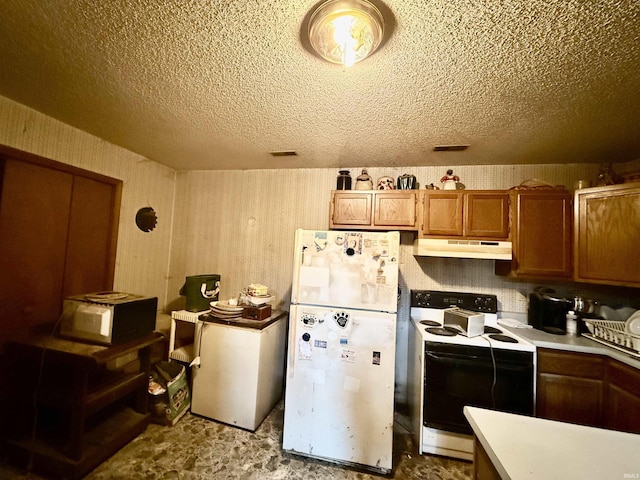 1839 S Meridian Rd, Mitchell, IN 47446 - kitchen featuring white appliances, under cabinet range hood, brown cabinets, a textured ceiling, and light countertops