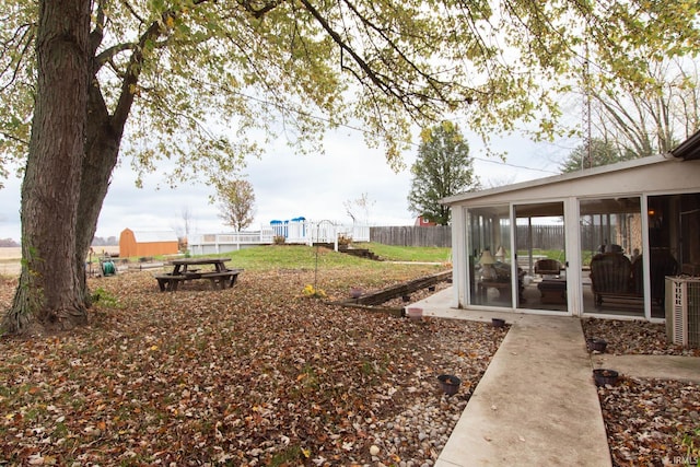 view of yard with a sunroom