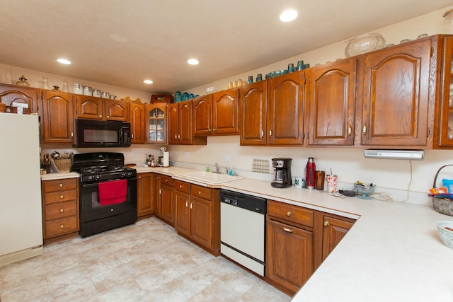 kitchen featuring black appliances and sink