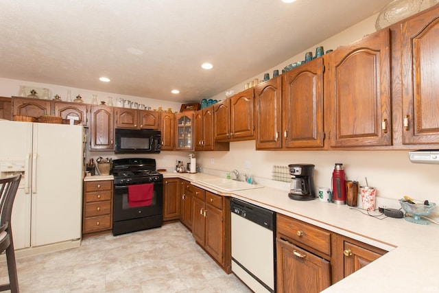 kitchen with sink and black appliances