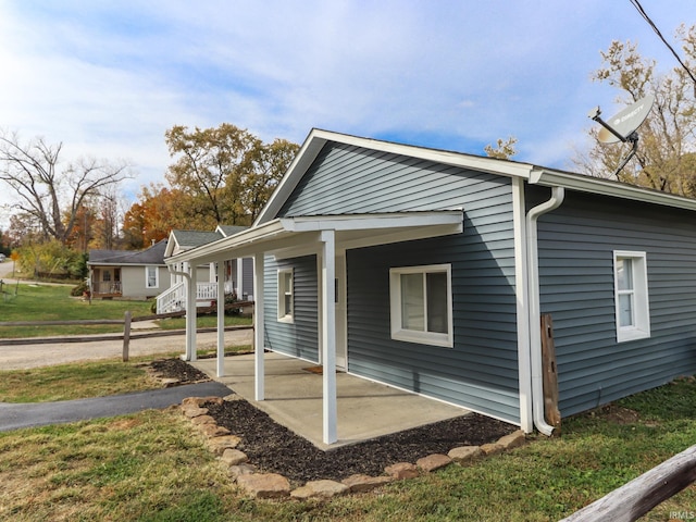 view of home's exterior with a yard