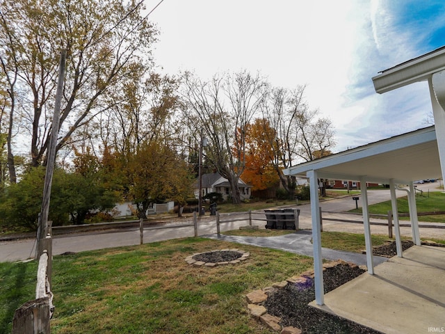 view of yard featuring an outdoor fire pit