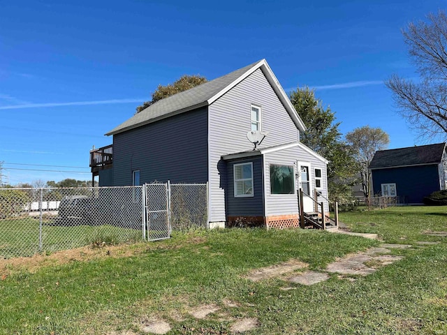 view of home's exterior with a lawn