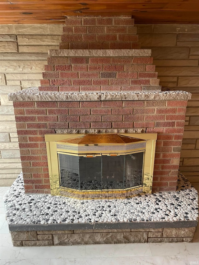 room details featuring a brick fireplace